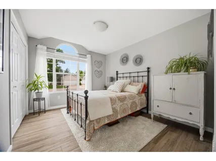 a bedroom with a bed and a dresser