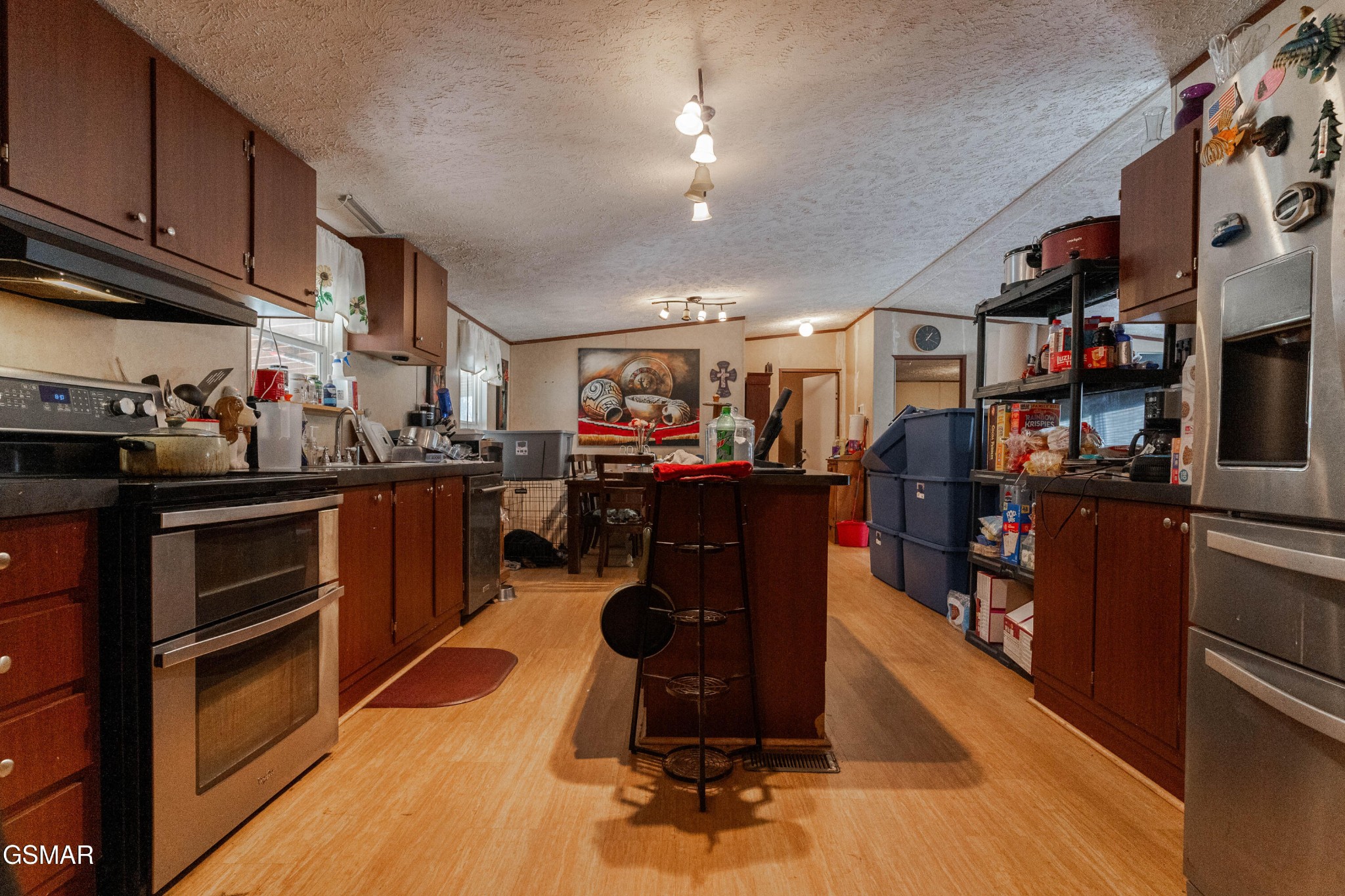 275 Crowder Road Madisonville, TN 37354 - Photo 10 of 21 a room with wooden floors and lots of appliances