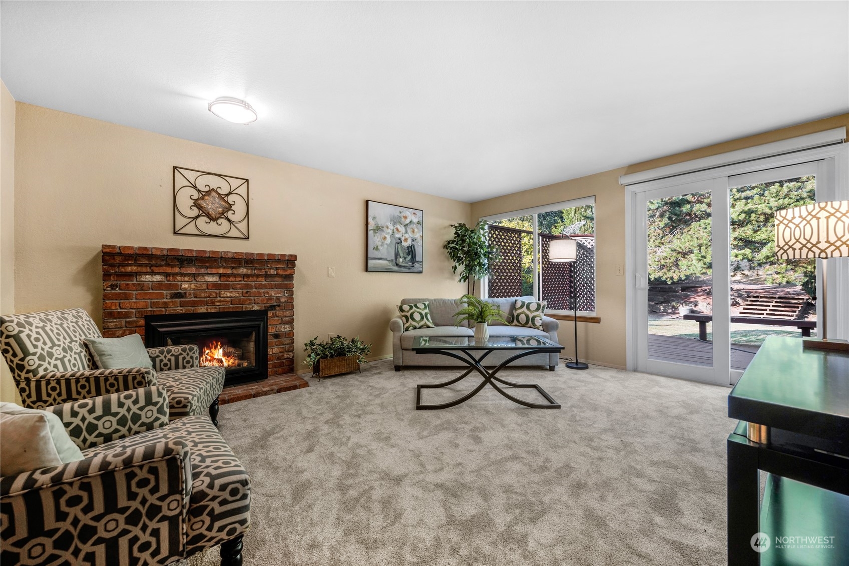 23323 12th Place West Bothell, WA 98021 - Photo 11 of 36 a living room with furniture a fireplace and a large window