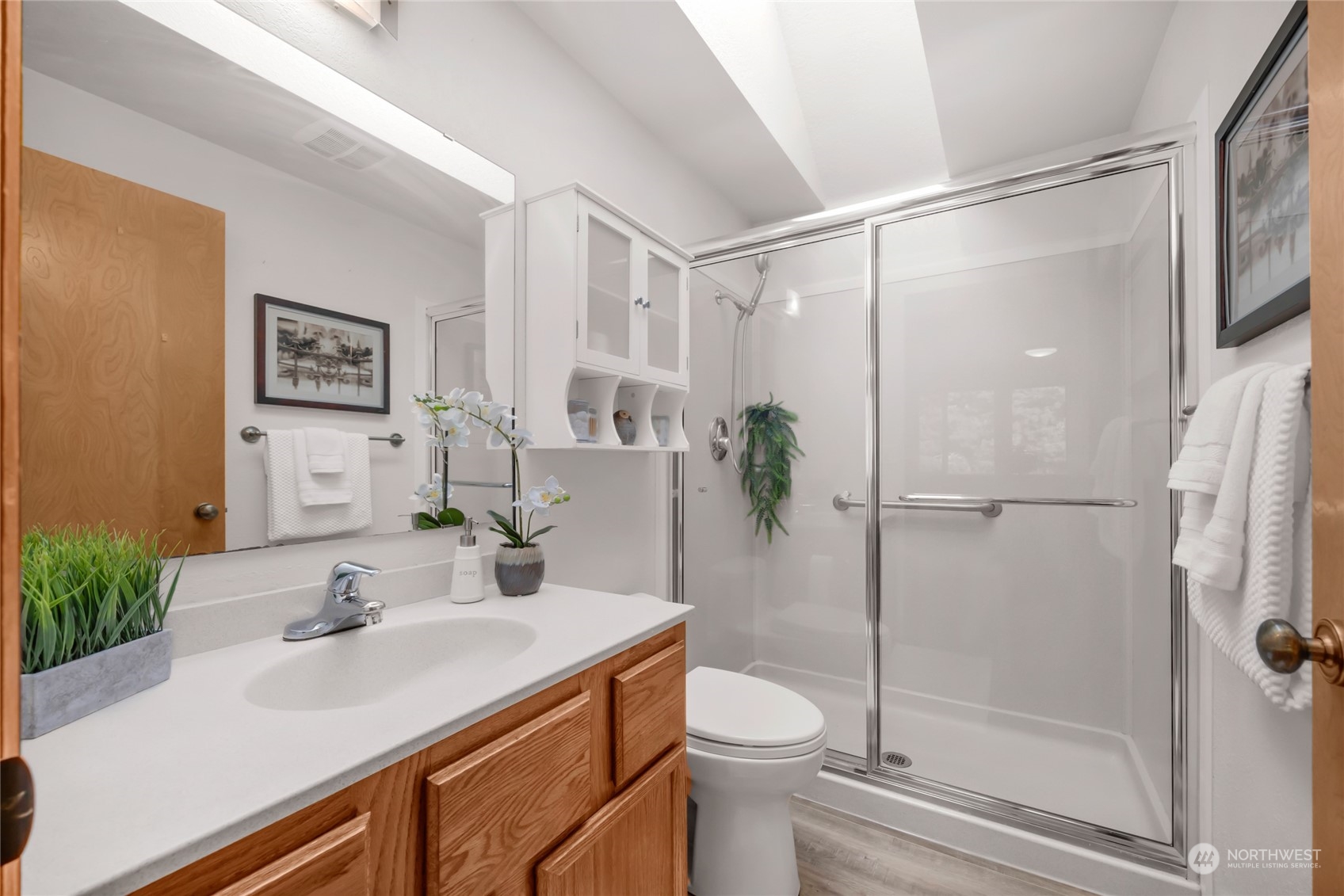 23323 12th Place West Bothell, WA 98021 - Photo 17 of 36 a bathroom with a sink toilet and shower