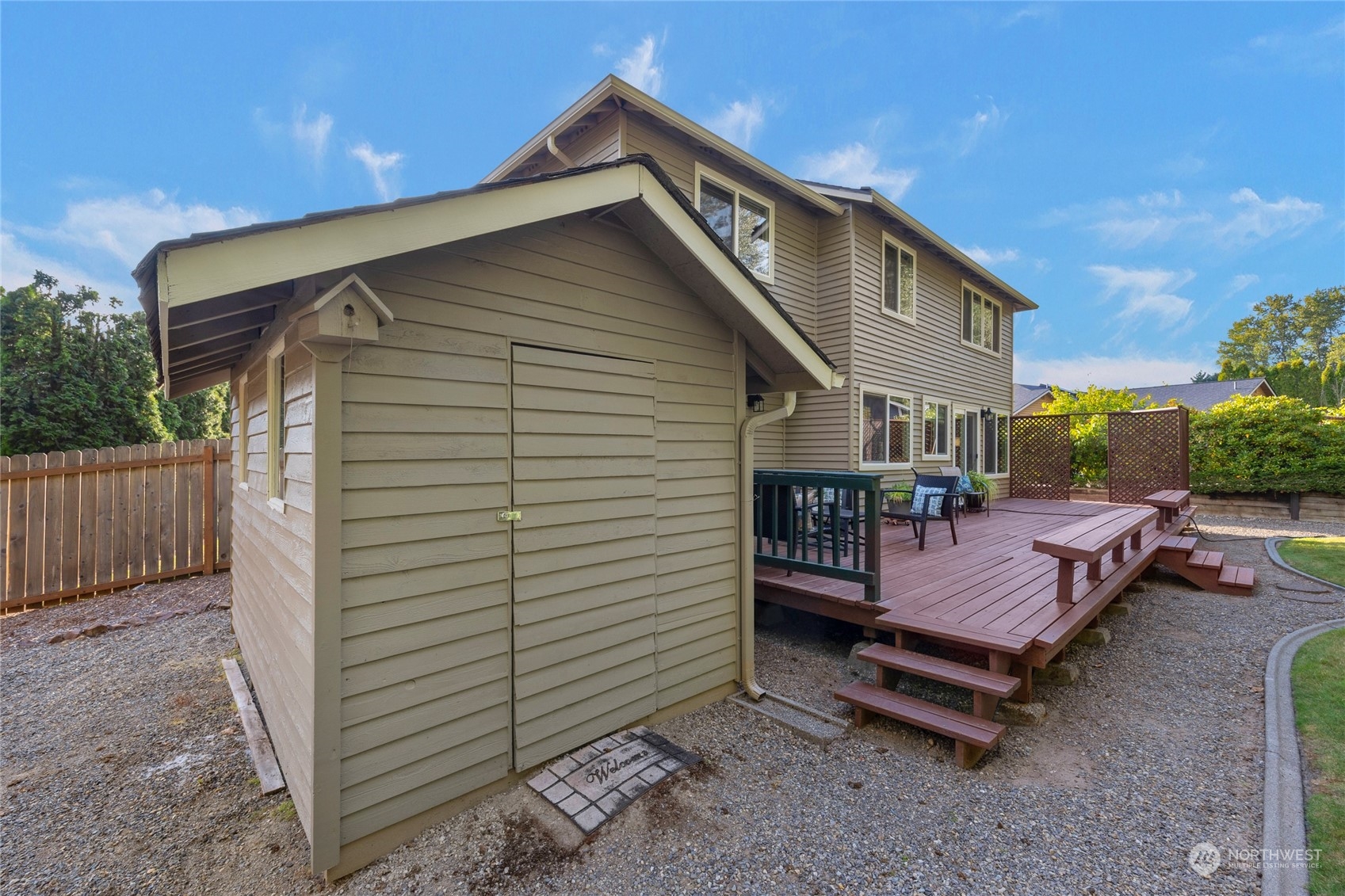 23323 12th Place West Bothell, WA 98021 - Photo 23 of 36 a view of a house with a yard and wooden fence