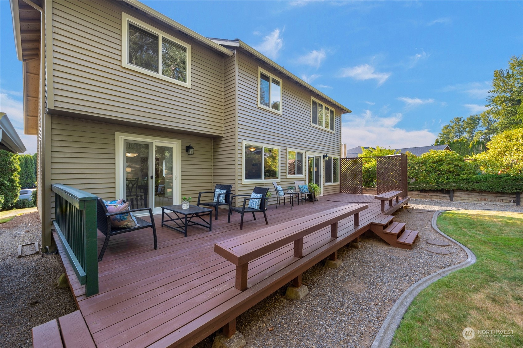 23323 12th Place West Bothell, WA 98021 - Photo 24 of 36 a view of a house and chair and tables in the patio