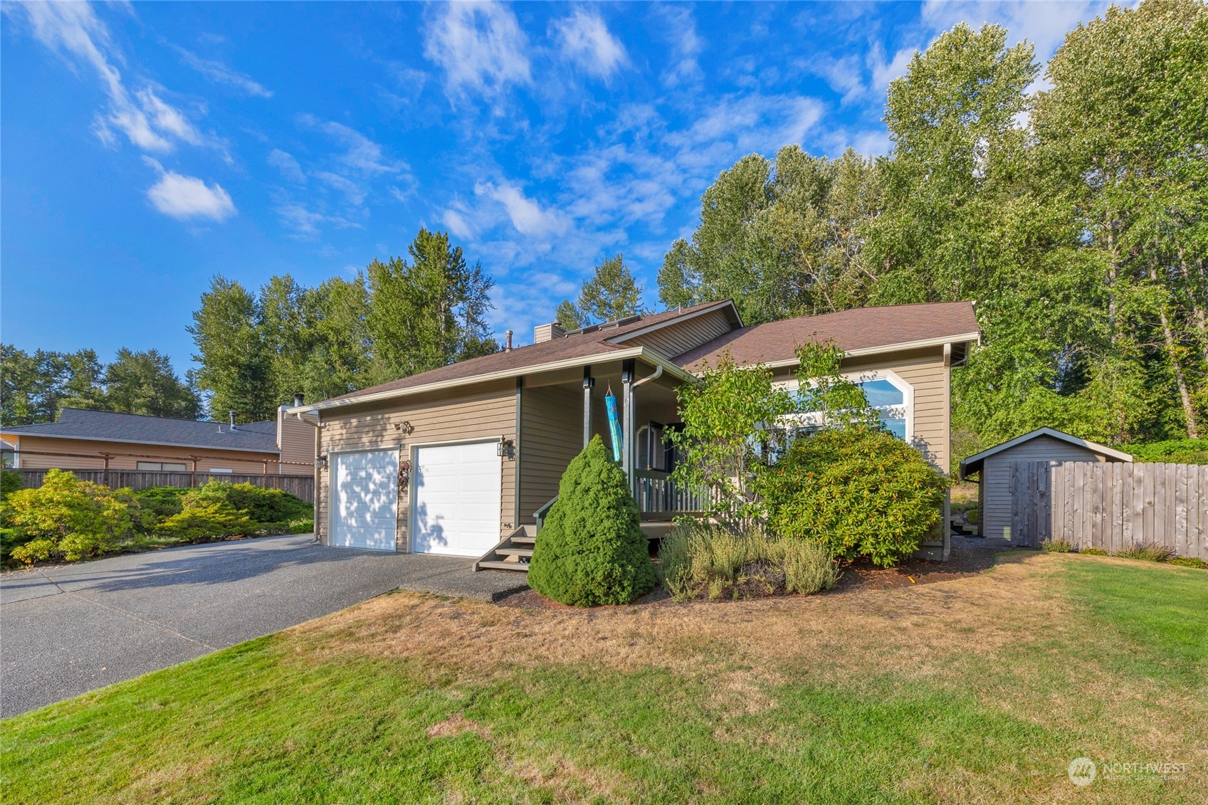 23323 12th Place West Bothell, WA 98021 - Photo 26 of 36 a front view of a house with garden
