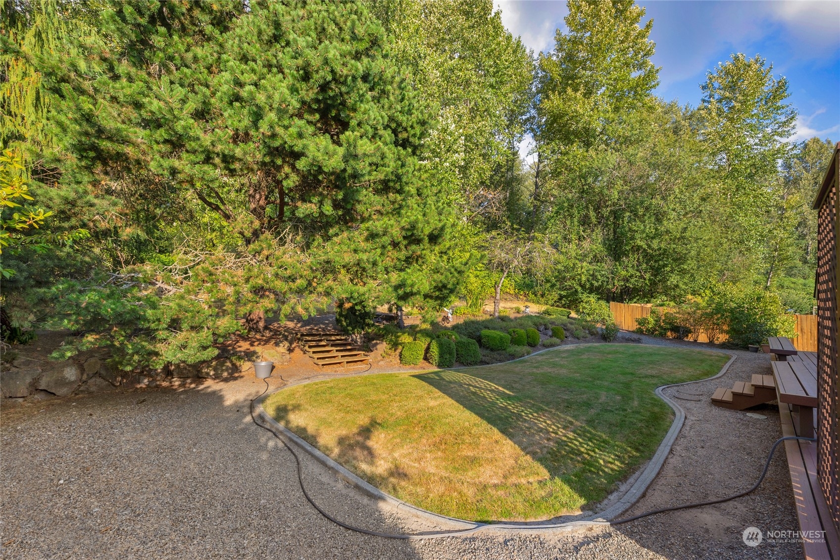 23323 12th Place West Bothell, WA 98021 - Photo 27 of 36 a view of a swimming pool with a outdoor seating and trees