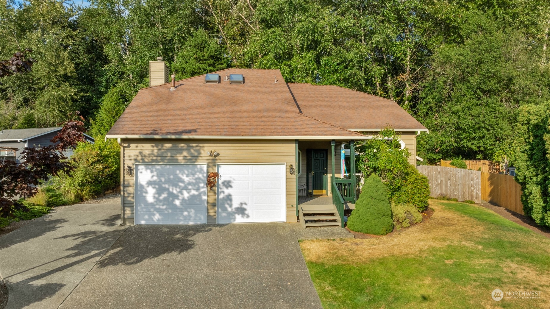 23323 12th Place West Bothell, WA 98021 - Photo 32 of 36 a house with trees in the background