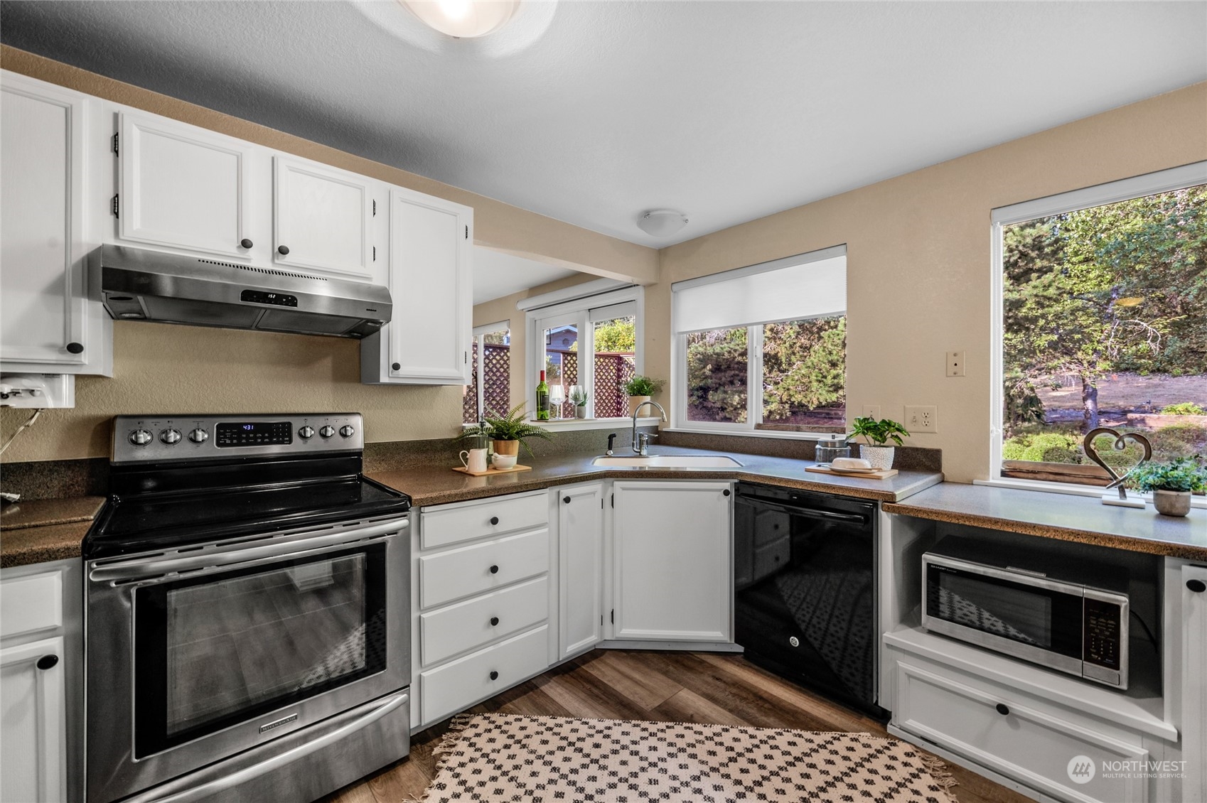 23323 12th Place West Bothell, WA 98021 - Photo 9 of 36 a kitchen with a stove and a sink