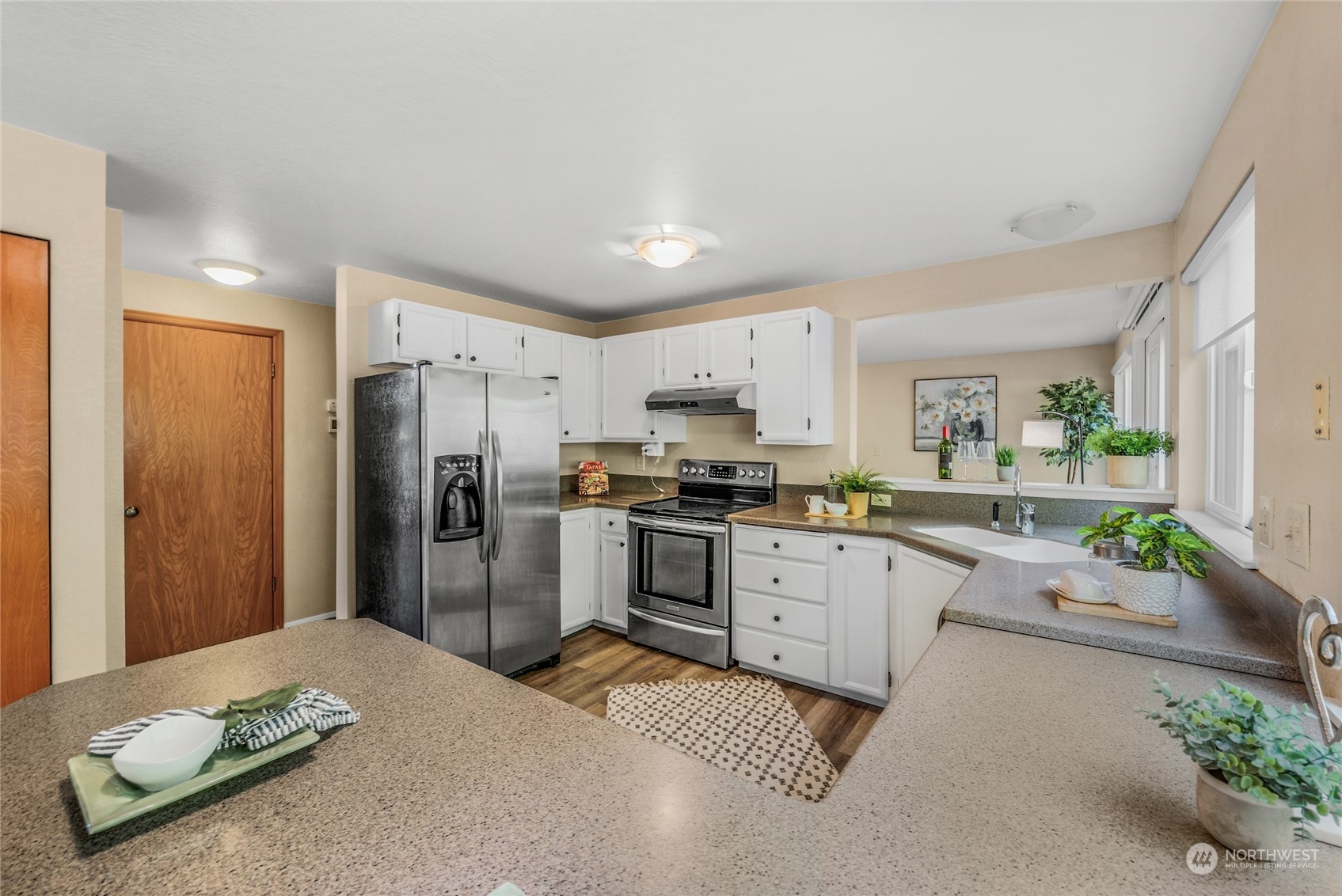 23323 12th Place West Bothell, WA 98021 - Photo 10 of 36 a kitchen with granite countertop a refrigerator and a sink