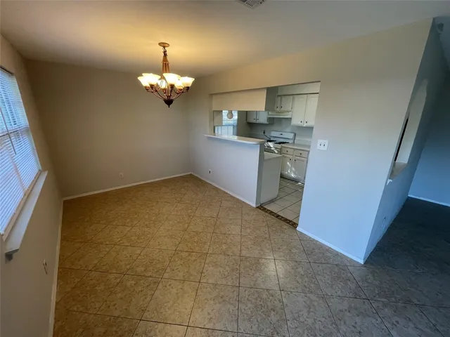 a view of a kitchen with a sink and dishwasher