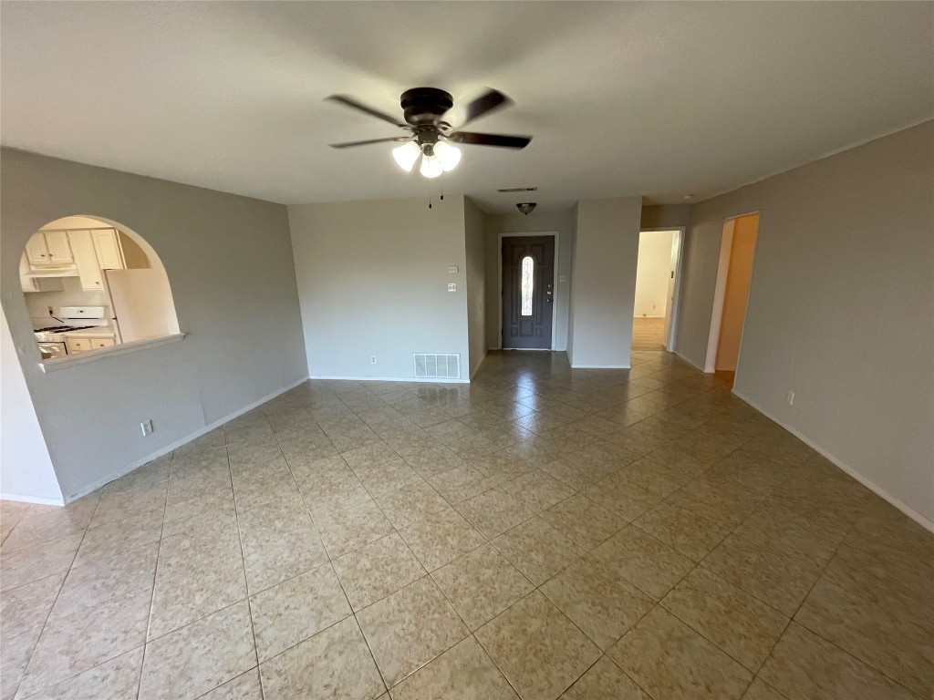 12013 Swallow Drive Austin, TX 78750 - Photo 14 of 25 an empty room with chandelier fan and windows