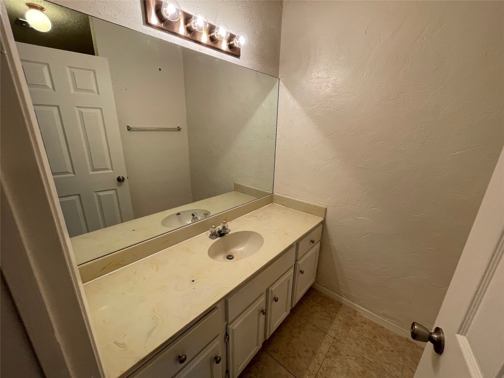 12013 Swallow Drive Austin, TX 78750 - Photo 18 of 25 a bathroom with a sink and a mirror