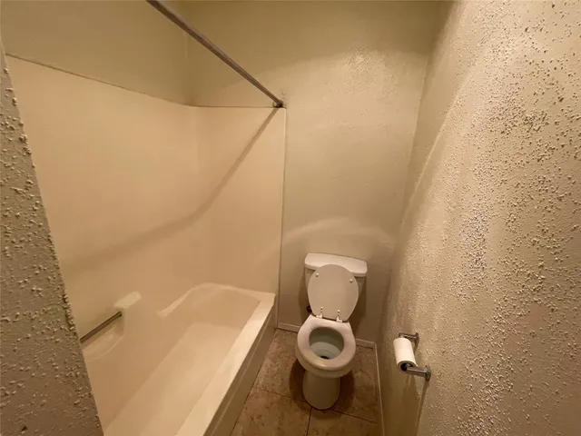 a bathroom with a toilet and a sink