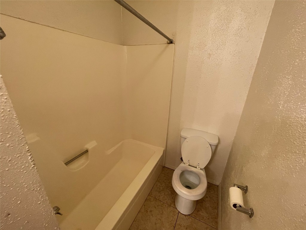 12013 Swallow Drive Austin, TX 78750 - Photo 20 of 25 a bathroom with a granite countertop toilet and a sink