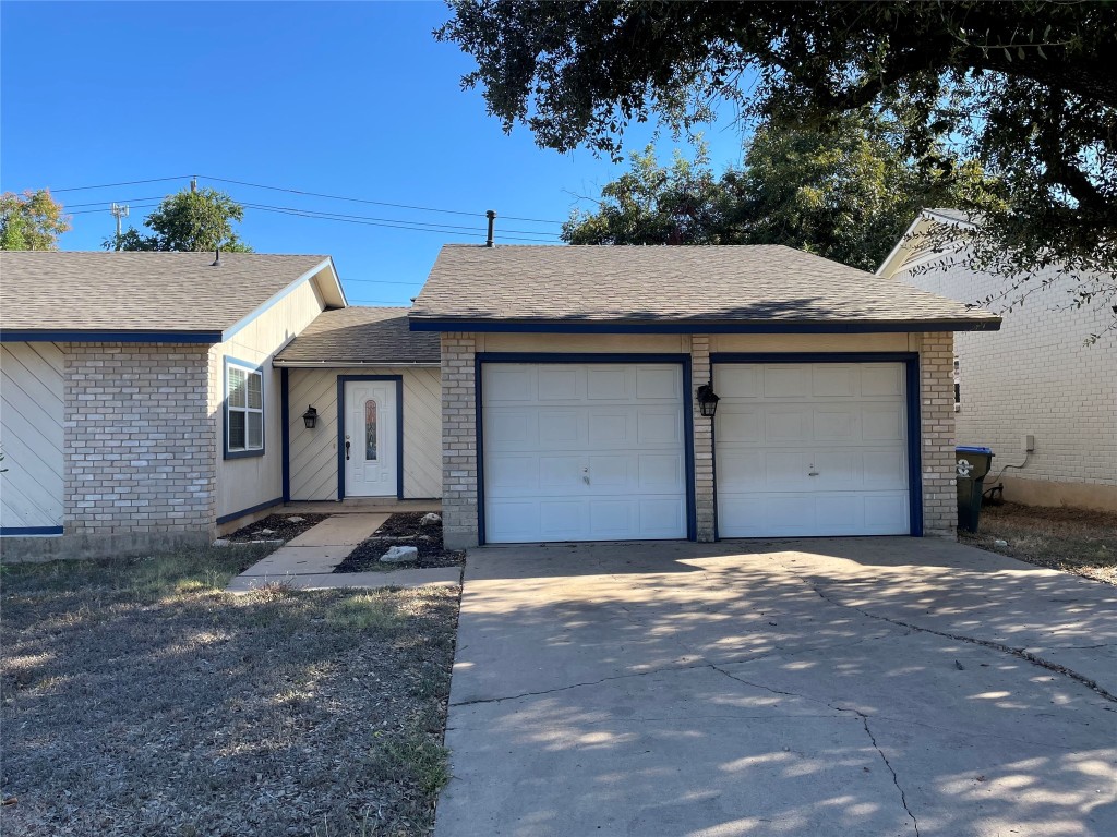 12013 Swallow Drive Austin, TX 78750 - Photo 2 of 25 a front view of a house with a yard