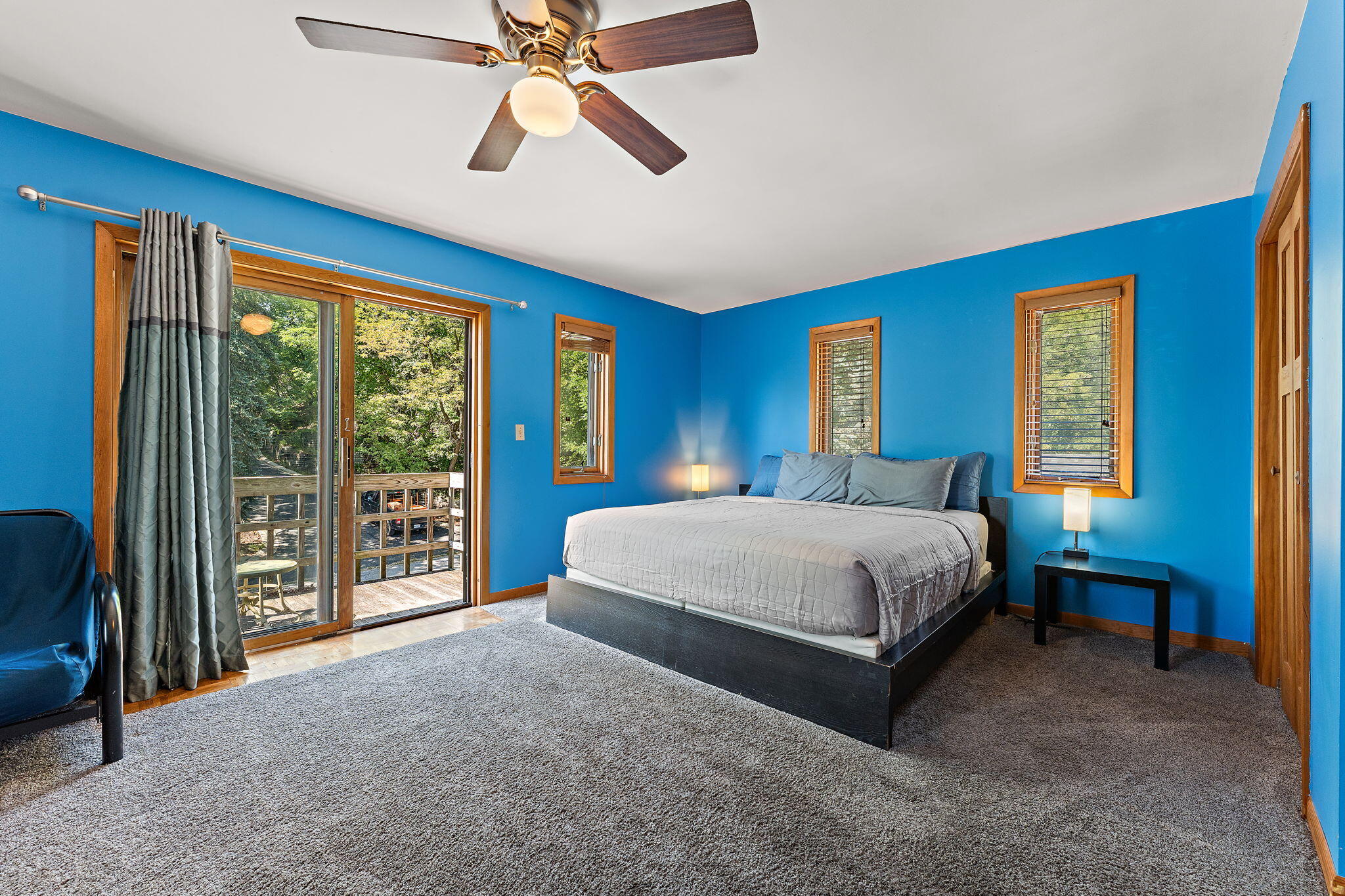 225 Warren Road Michigan City, IN 46360 - Photo 19 of 47 a spacious bedroom with a bed a dresser and a chandelier