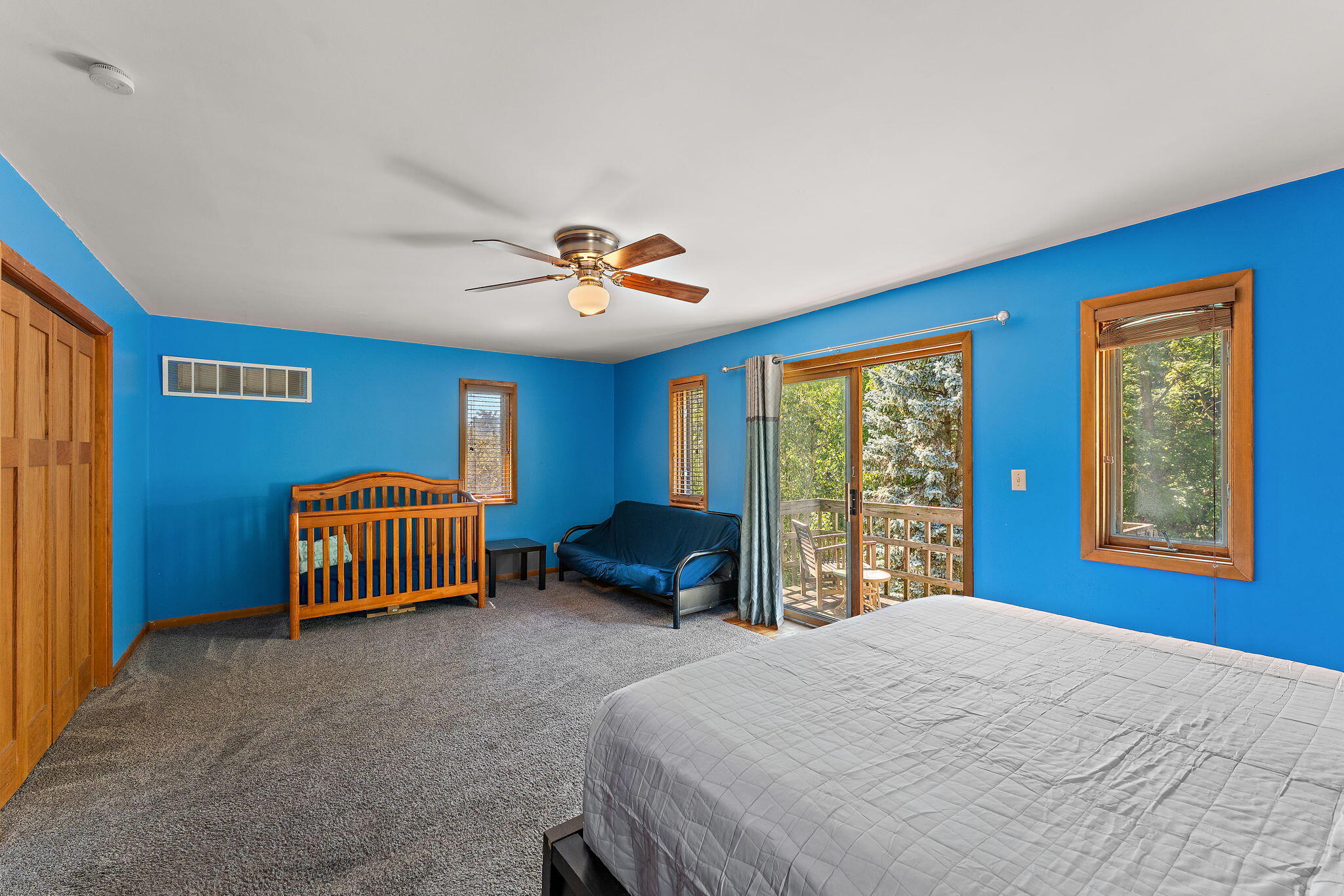 225 Warren Road Michigan City, IN 46360 - Photo 20 of 47 a bedroom with a bed and a large window