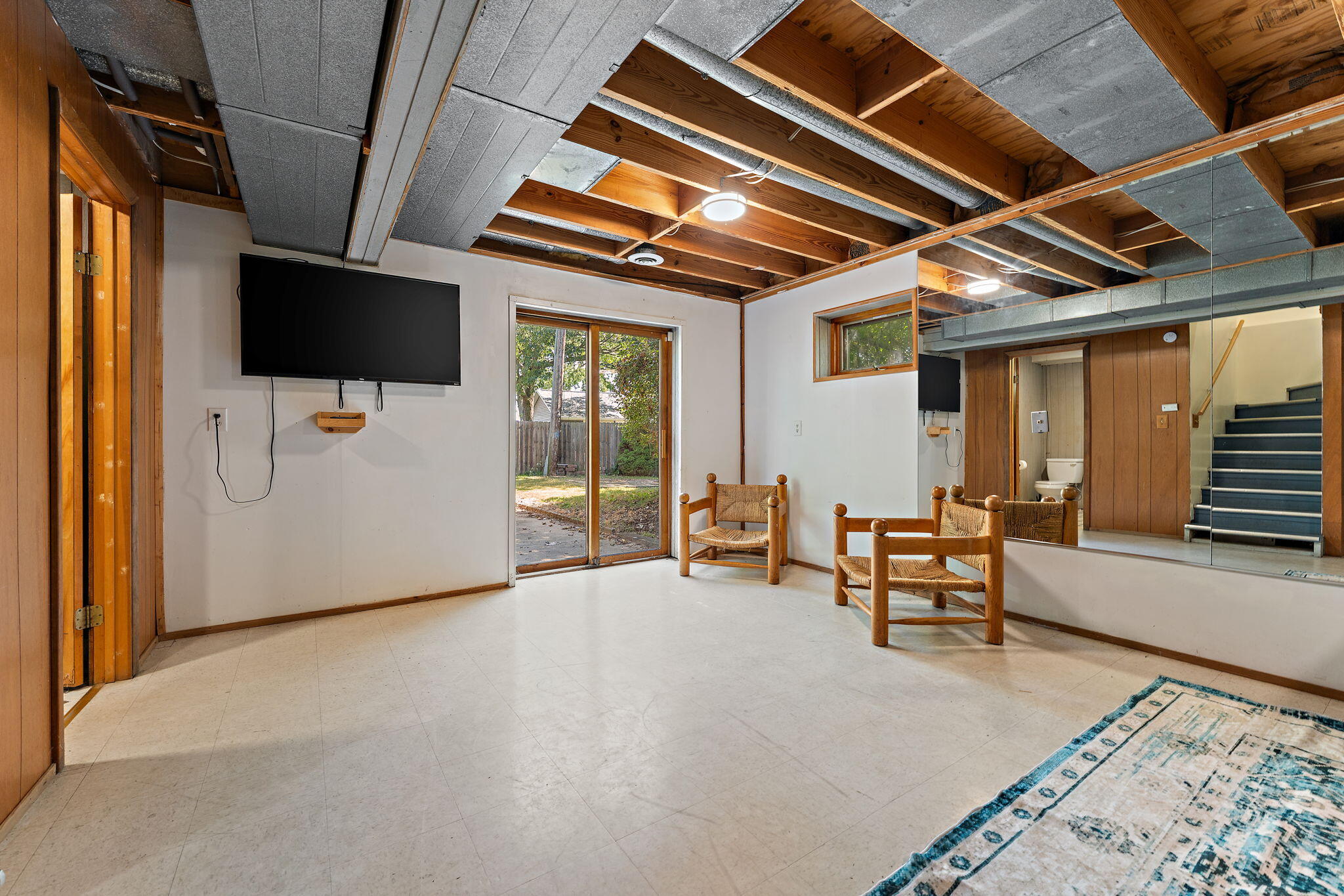 225 Warren Road Michigan City, IN 46360 - Photo 26 of 47 a view of a livingroom with furniture and a flat screen tv