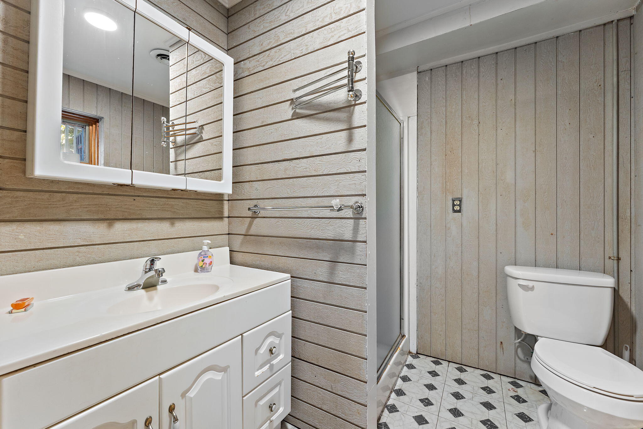 225 Warren Road Michigan City, IN 46360 - Photo 29 of 47 a bathroom with a sink a toilet and shower