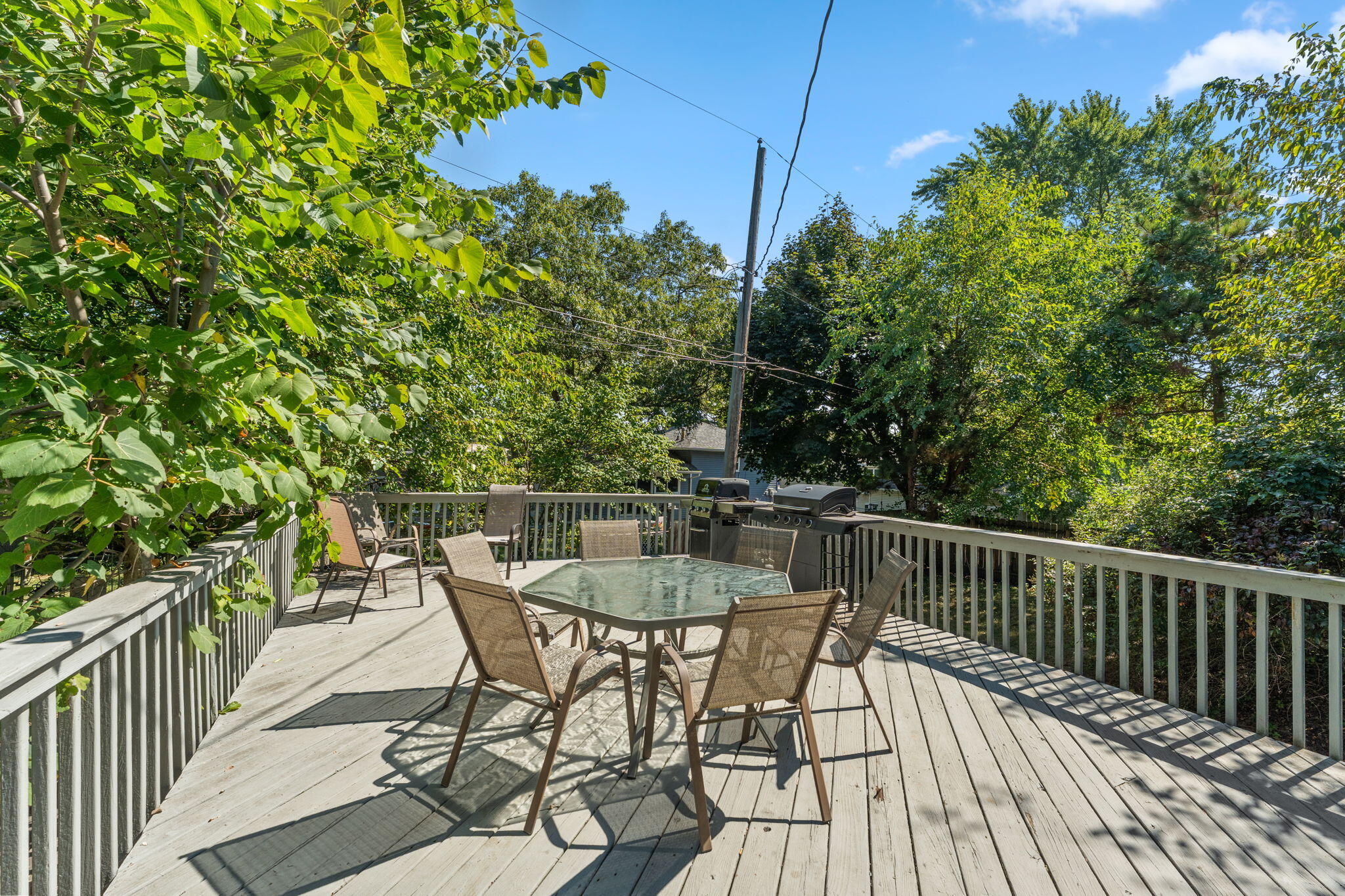 225 Warren Road Michigan City, IN 46360 - Photo 32 of 47 a view of a wooden chairs and table in the balcony