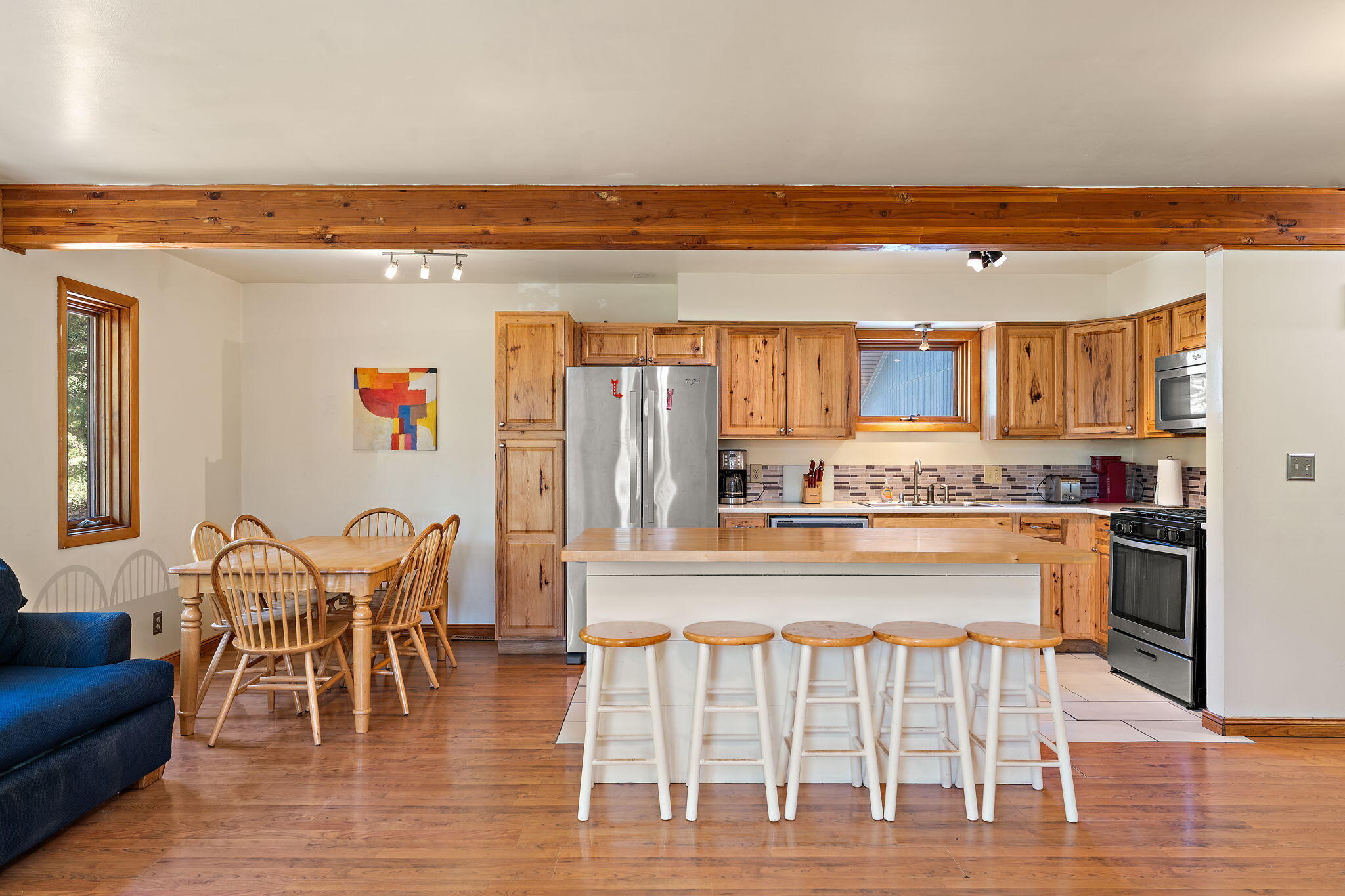225 Warren Road Michigan City, IN 46360 - Photo 10 of 47 a view of a dining room with furniture and wooden floor