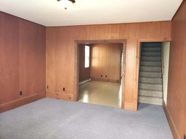 an empty room with closet area