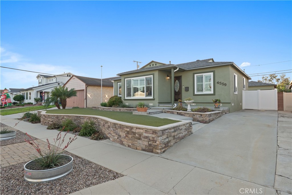 4559 Levelside Avenue Lakewood, CA 90712 - Photo 1 of 32 a front view of a house with garden