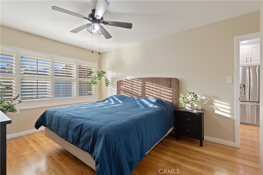 4559 Levelside Avenue Lakewood, CA 90712 - Photo 15 of 32 a bedroom with a bed and a chandelier