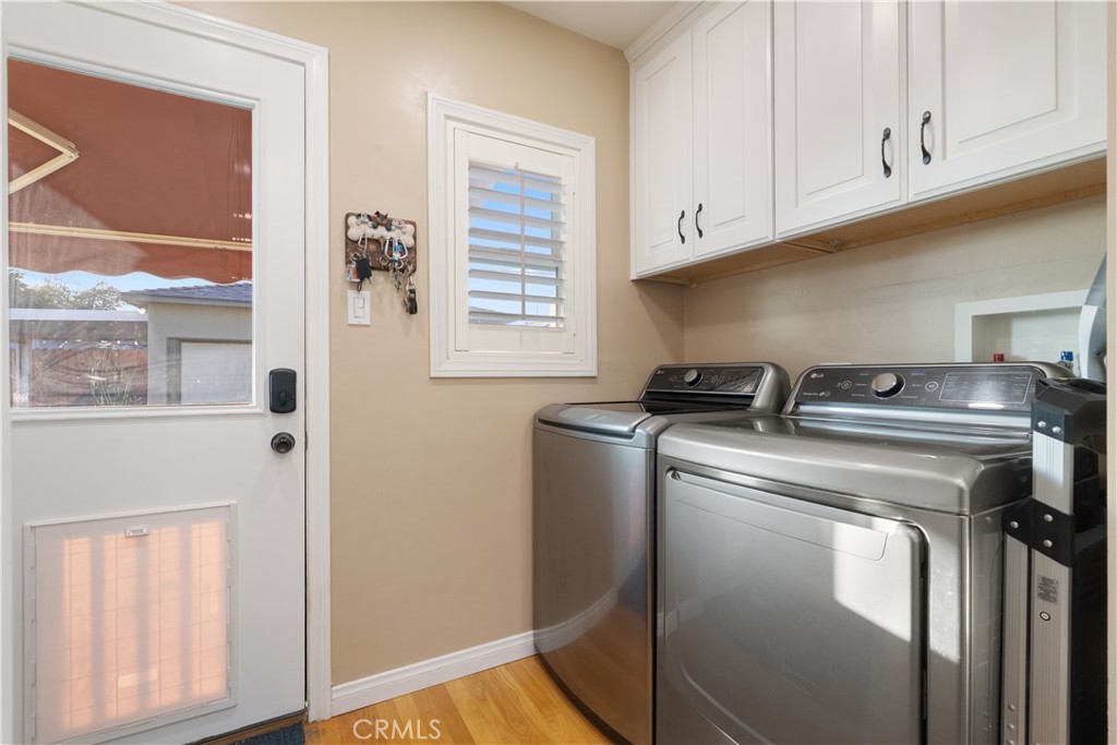 4559 Levelside Avenue Lakewood, CA 90712 - Photo 20 of 32 a kitchen with granite countertop white cabinets and a stove