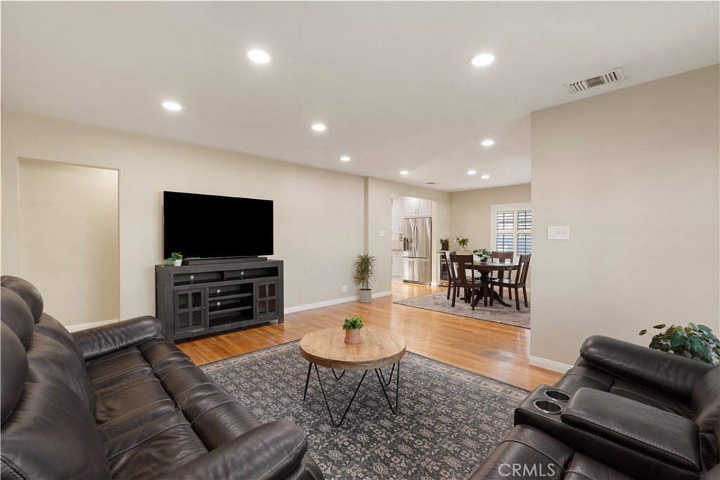 4559 Levelside Avenue Lakewood, CA 90712 - Photo 7 of 32 a living room with furniture and a flat screen tv