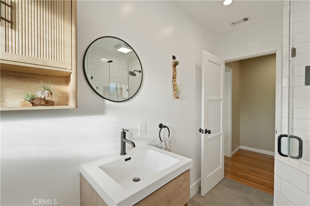 4559 Levelside Avenue Lakewood, CA 90712 - Photo 10 of 32 a bathroom with a sink and a mirror