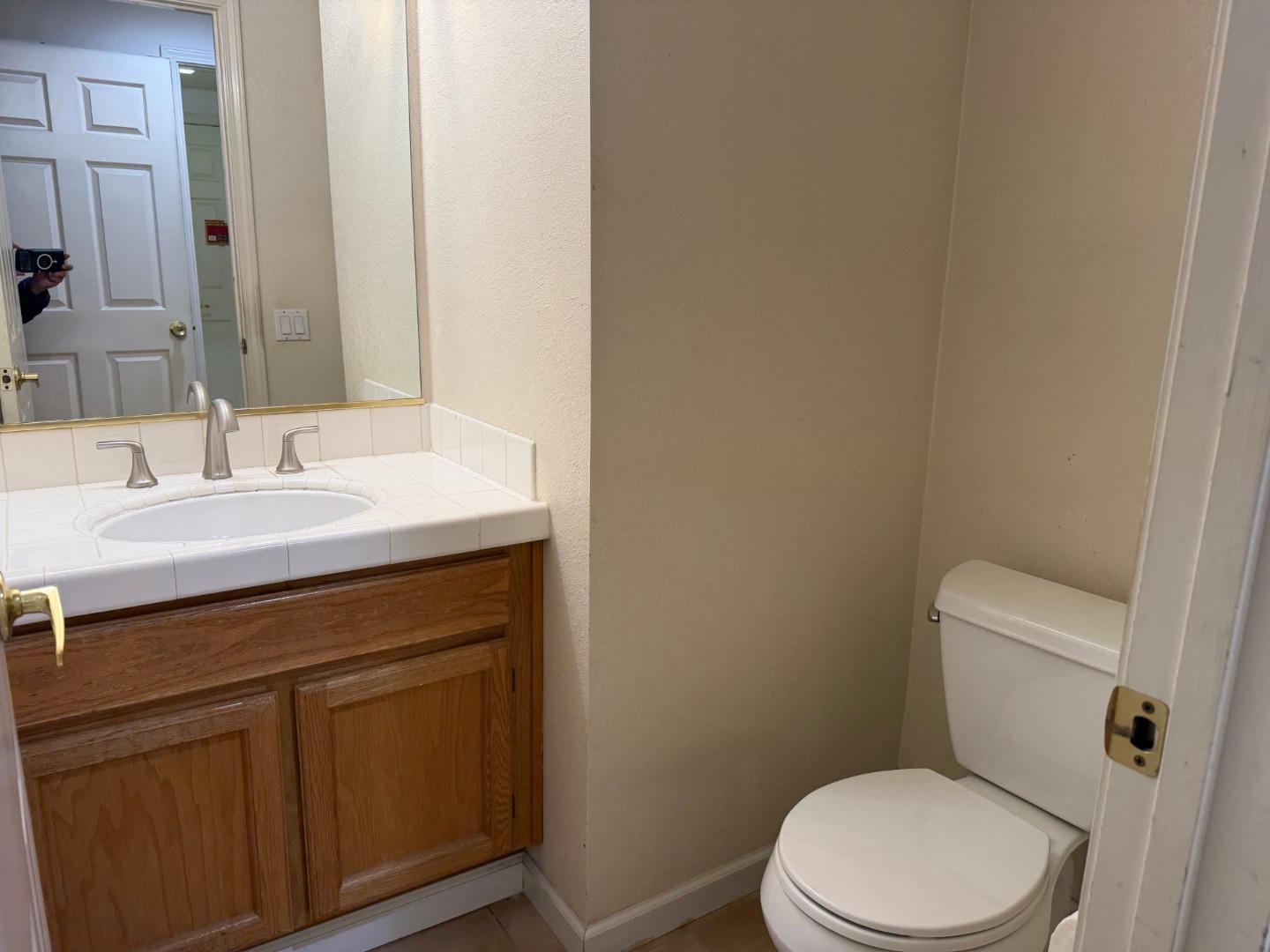 5417 Ridgewood Drive Fremont, CA 94555 - Photo 13 of 36 a bathroom with a sink a toilet and a mirror
