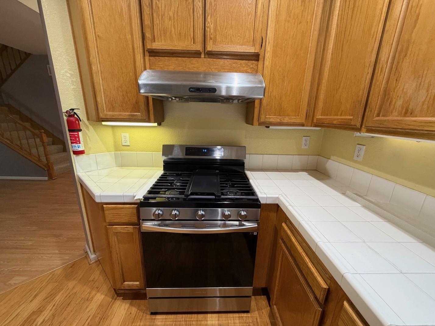 5417 Ridgewood Drive Fremont, CA 94555 - Photo 17 of 36 a stove top oven sitting inside of a kitchen