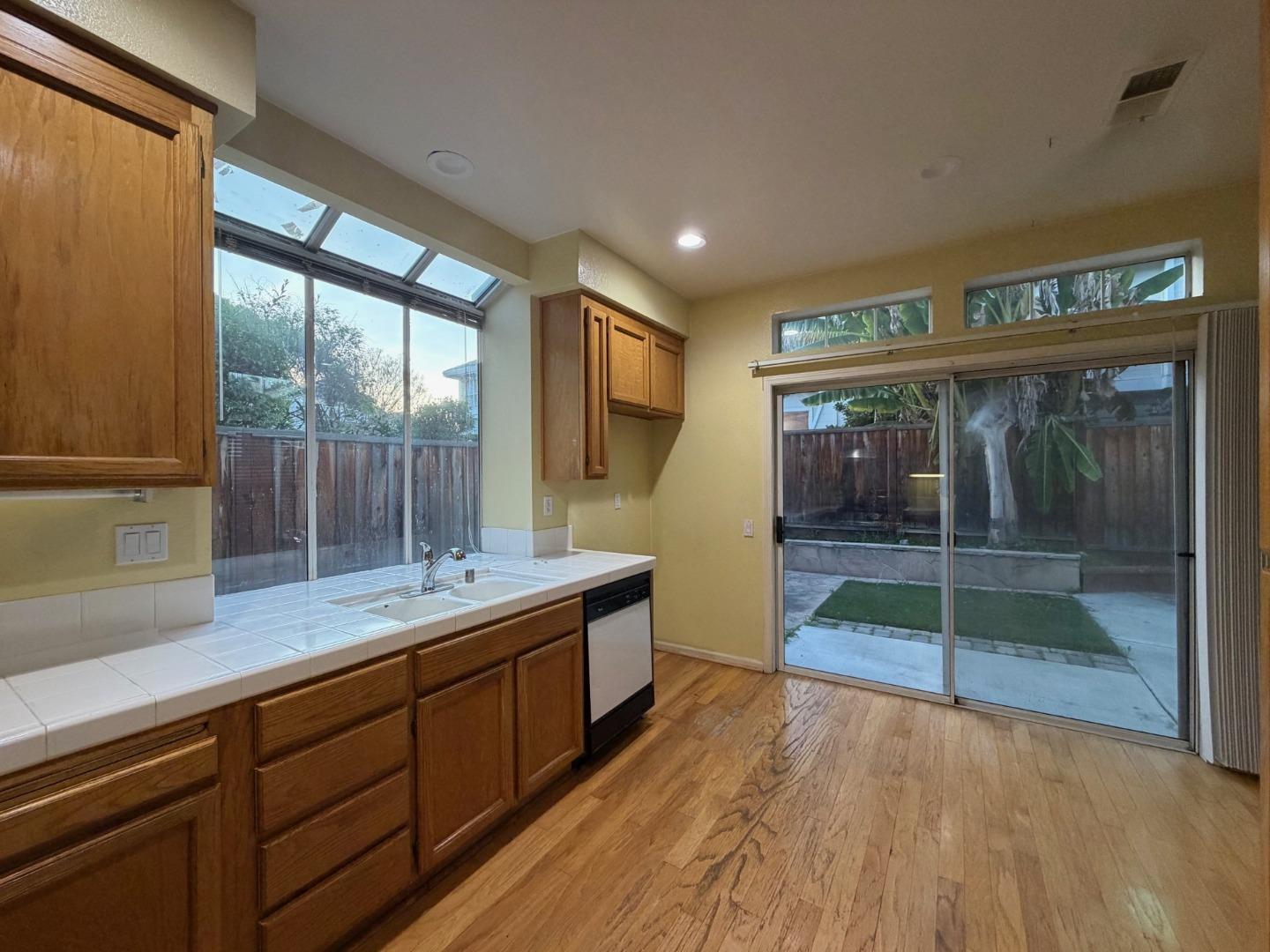 5417 Ridgewood Drive Fremont, CA 94555 - Photo 18 of 36 a dining hall with stainless steel appliances granite countertop a sink and wooden cabinets