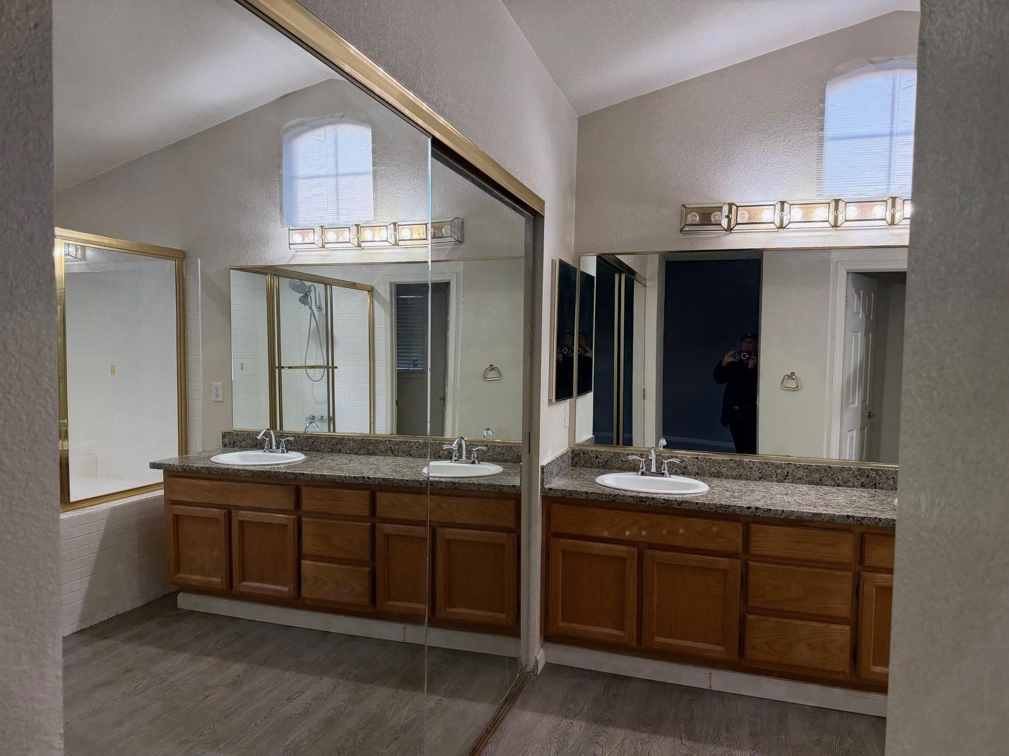 5417 Ridgewood Drive Fremont, CA 94555 - Photo 23 of 36 a bathroom with a granite countertop double vanity sink and a large mirror