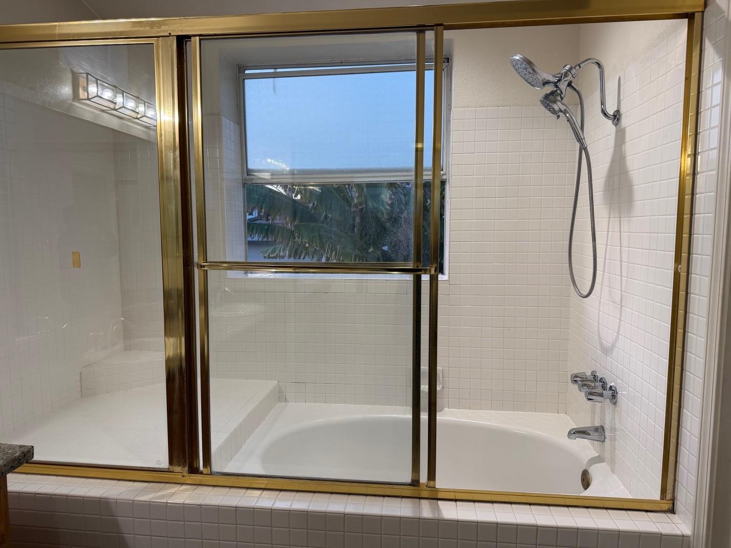 5417 Ridgewood Drive Fremont, CA 94555 - Photo 25 of 36 a bathroom with a bathtub and a shower