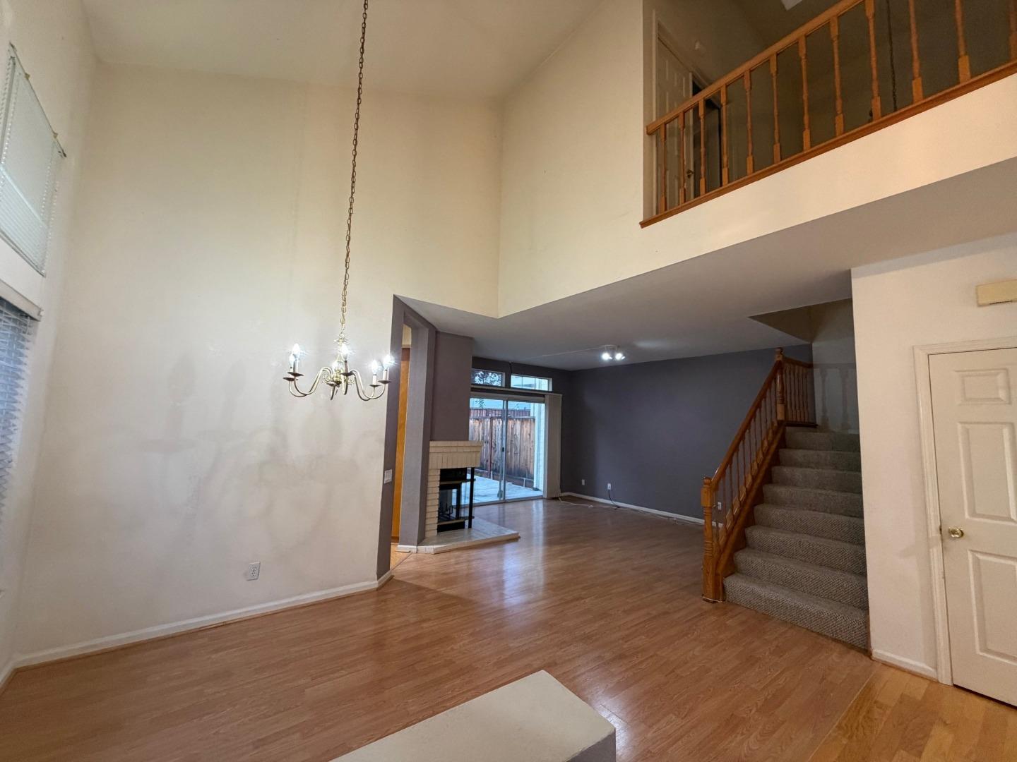 5417 Ridgewood Drive Fremont, CA 94555 - Photo 10 of 36 a view of a hallway with wooden floor and staircase