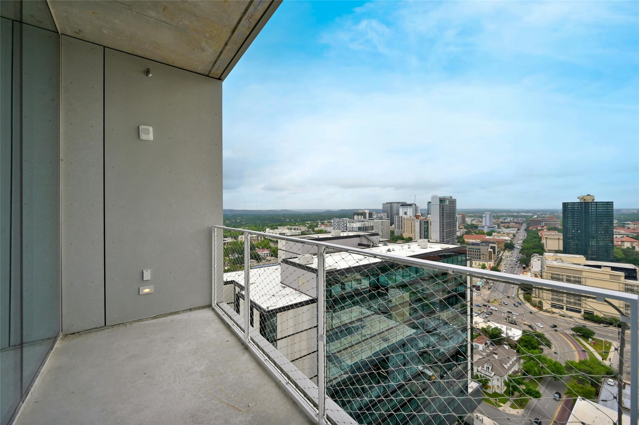 313 West 17th Street, Unit 2103 Austin, TX 78701 - Photo 15 of 39 Step outside to the balcony and immerse yourself in breathtaking views of the surrounding cityscape. This outdoor retreat offers a perfect spot to unwind and enjoy the fresh air while taking in the vibrant energy of the city.