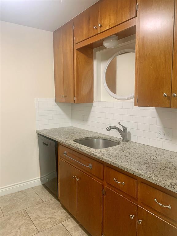 2302 Mesquite Lane, Unit A Georgetown, TX 78628 - Photo 3 of 11 a bathroom with a granite countertop sink a mirror and vanity