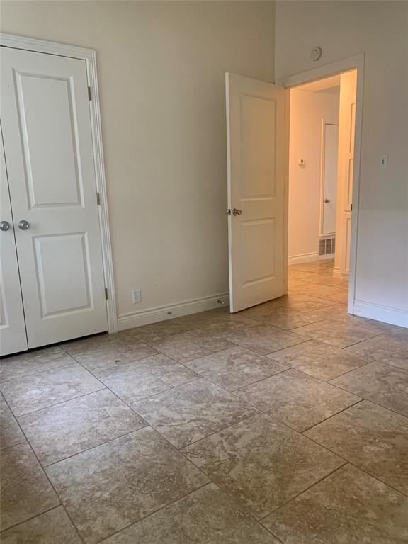 2302 Mesquite Lane, Unit A Georgetown, TX 78628 - Photo 10 of 11 Unfurnished room featuring baseboards