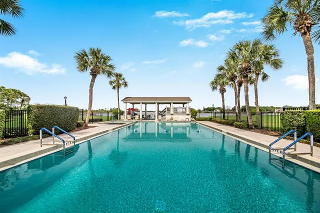 a view of a swimming pool with a table and chairs
