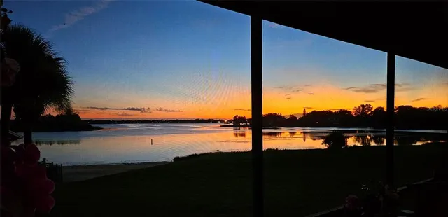 a balcony with furniture and a table