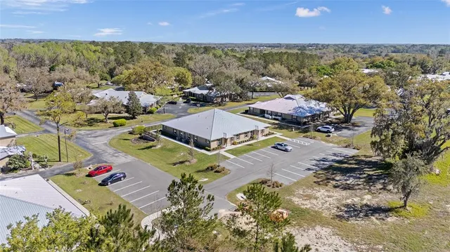 an aerial view of residential houses with outdoor space