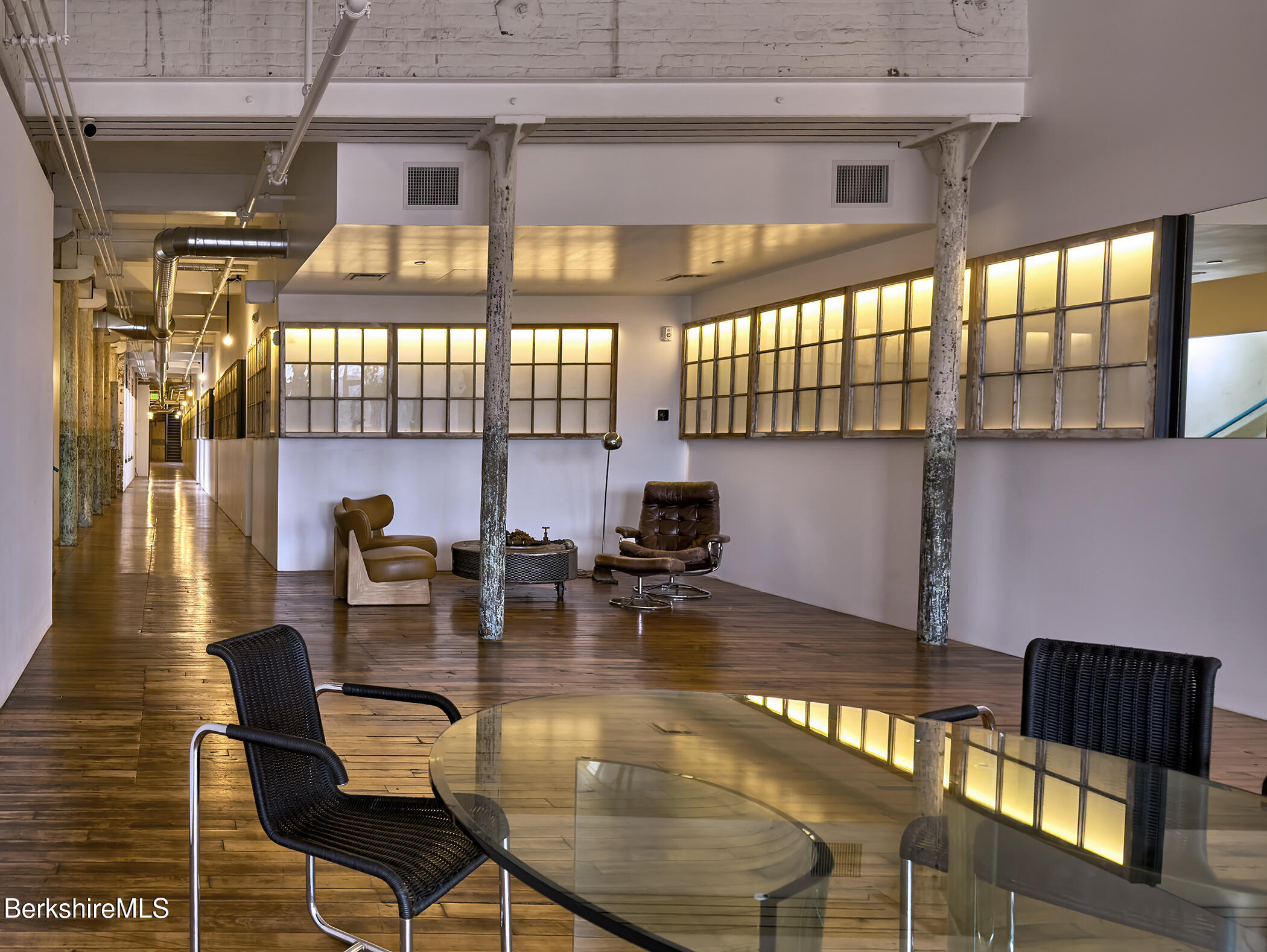 520 State Road, Unit 402 North Adams, MA 01247 - Photo 3 of 22 a dining room with furniture window and wooden floor
