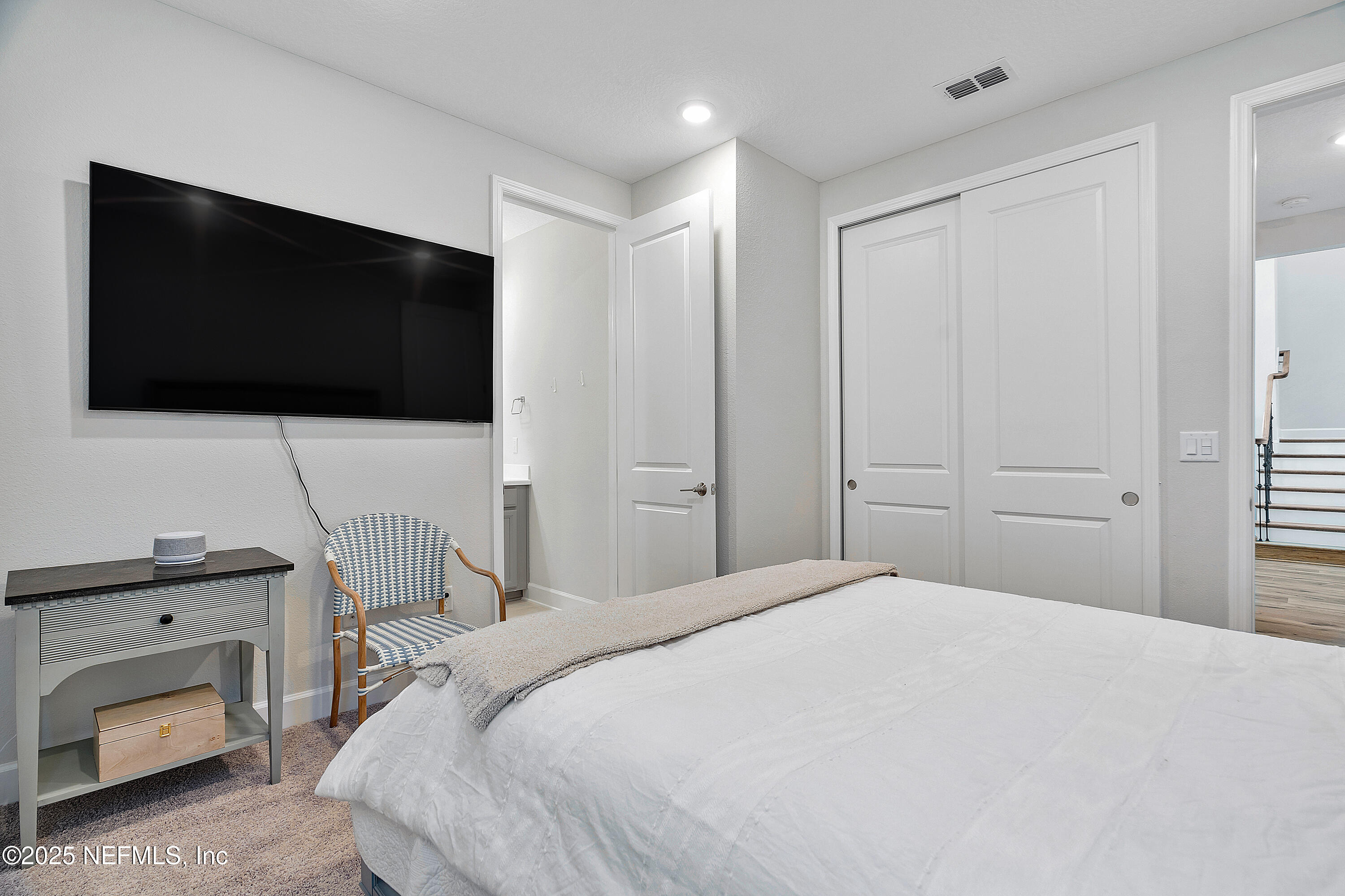 290 Marquesa Circle St. Johns, FL 32259 - Photo 21 of 107 a bedroom with a bed and a flat screen tv