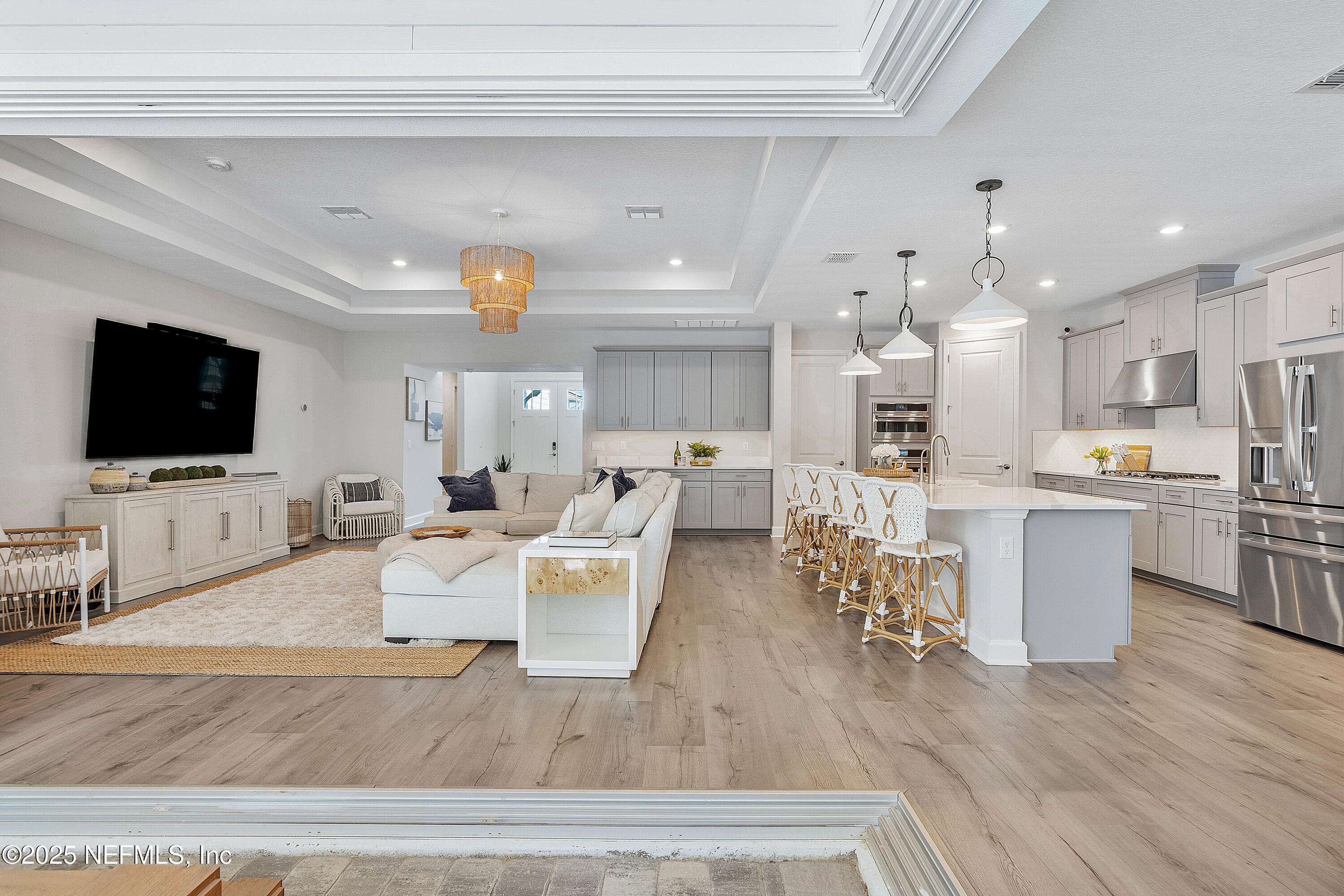 290 Marquesa Circle St. Johns, FL 32259 - Photo 26 of 107 a living room with furniture kitchen view and a flat screen tv