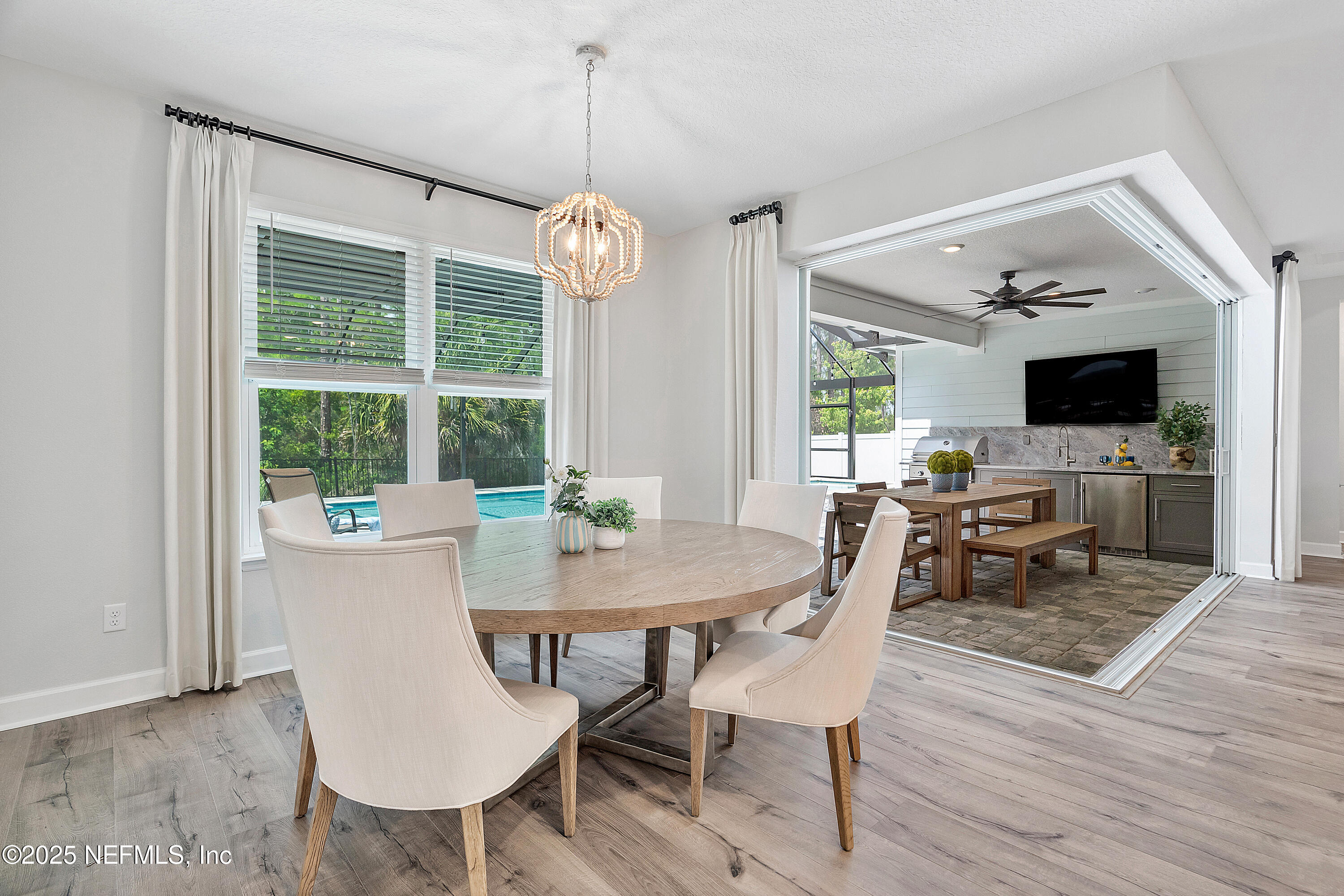 290 Marquesa Circle St. Johns, FL 32259 - Photo 36 of 107 a view of a dining room with furniture wooden floor and chandelier