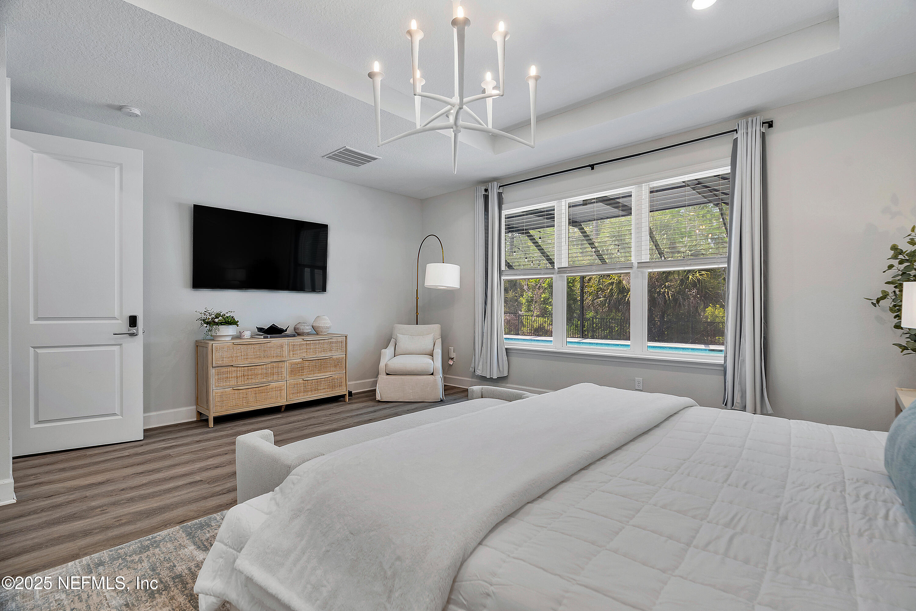 290 Marquesa Circle St. Johns, FL 32259 - Photo 41 of 107 a bedroom with a bed and a flat screen tv