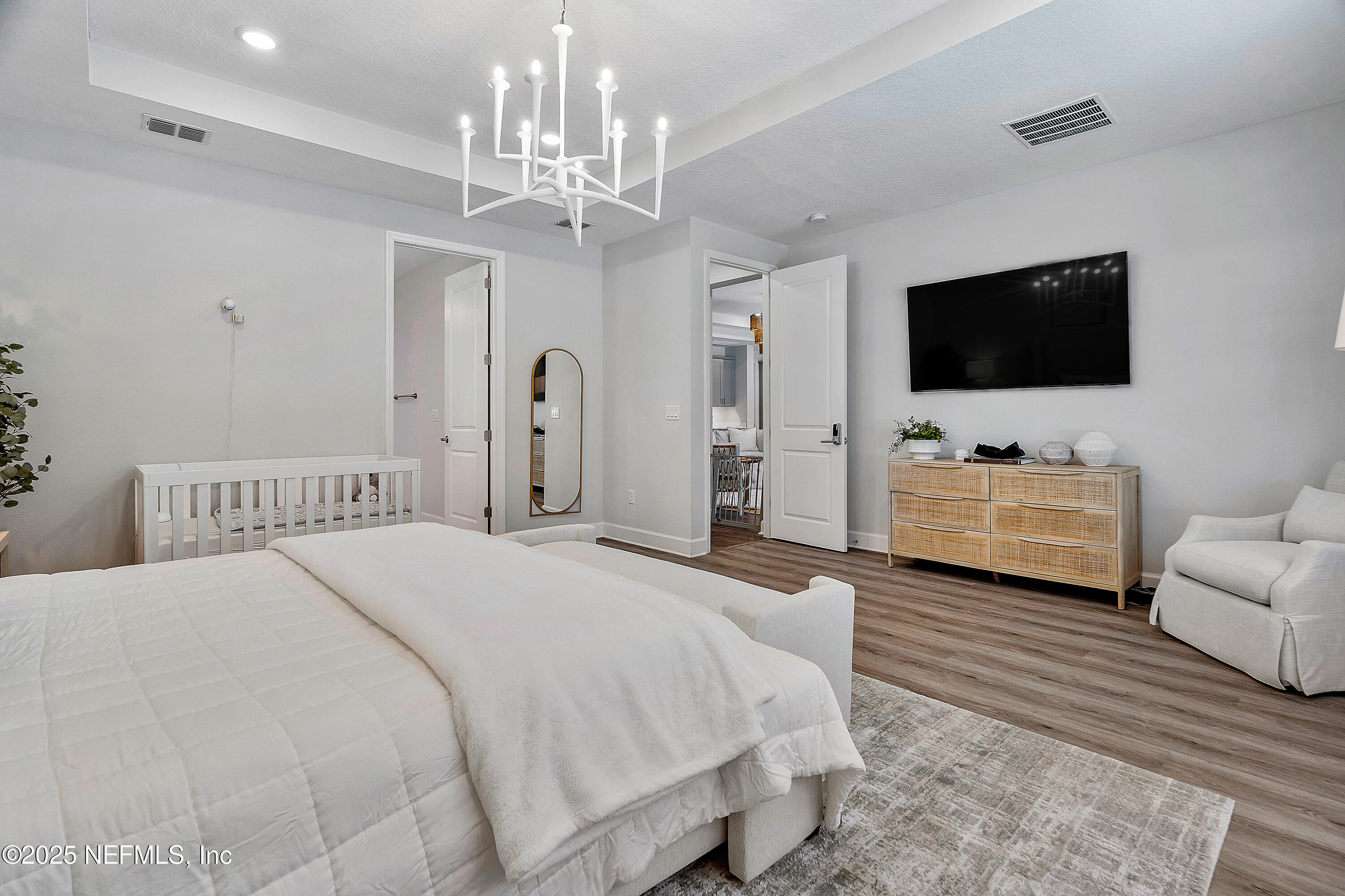 290 Marquesa Circle St. Johns, FL 32259 - Photo 42 of 107 a bedroom with a bed and a flat screen tv