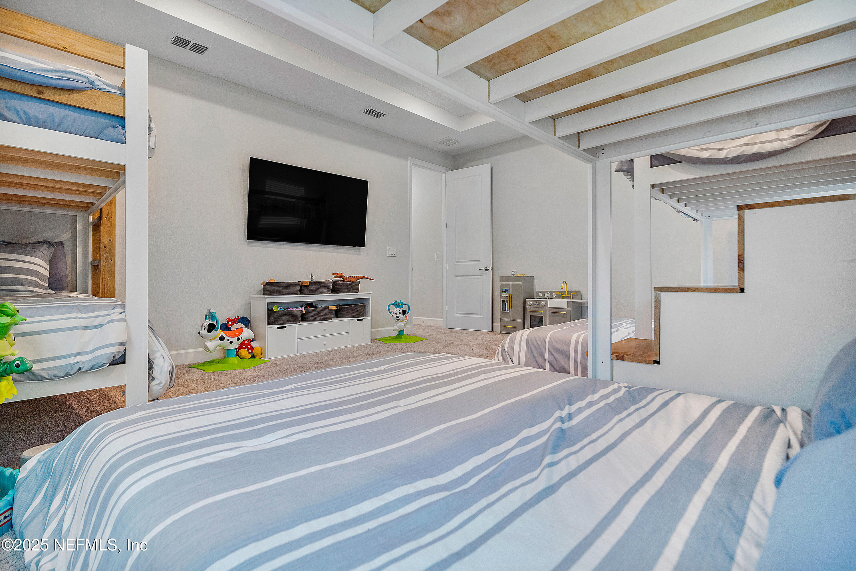 290 Marquesa Circle St. Johns, FL 32259 - Photo 54 of 107 a bedroom with a bed and a flat screen tv