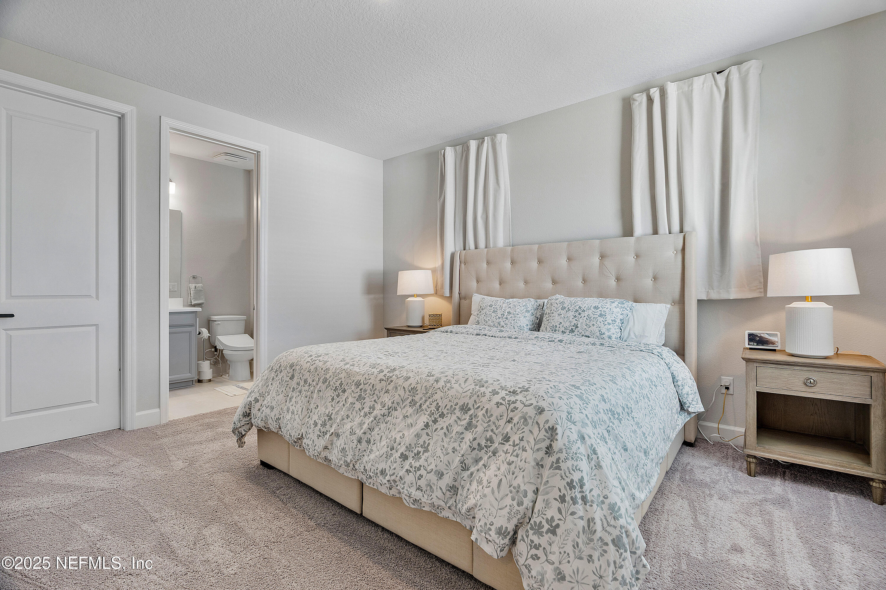 290 Marquesa Circle St. Johns, FL 32259 - Photo 61 of 107 a bedroom with a bed and a lamp