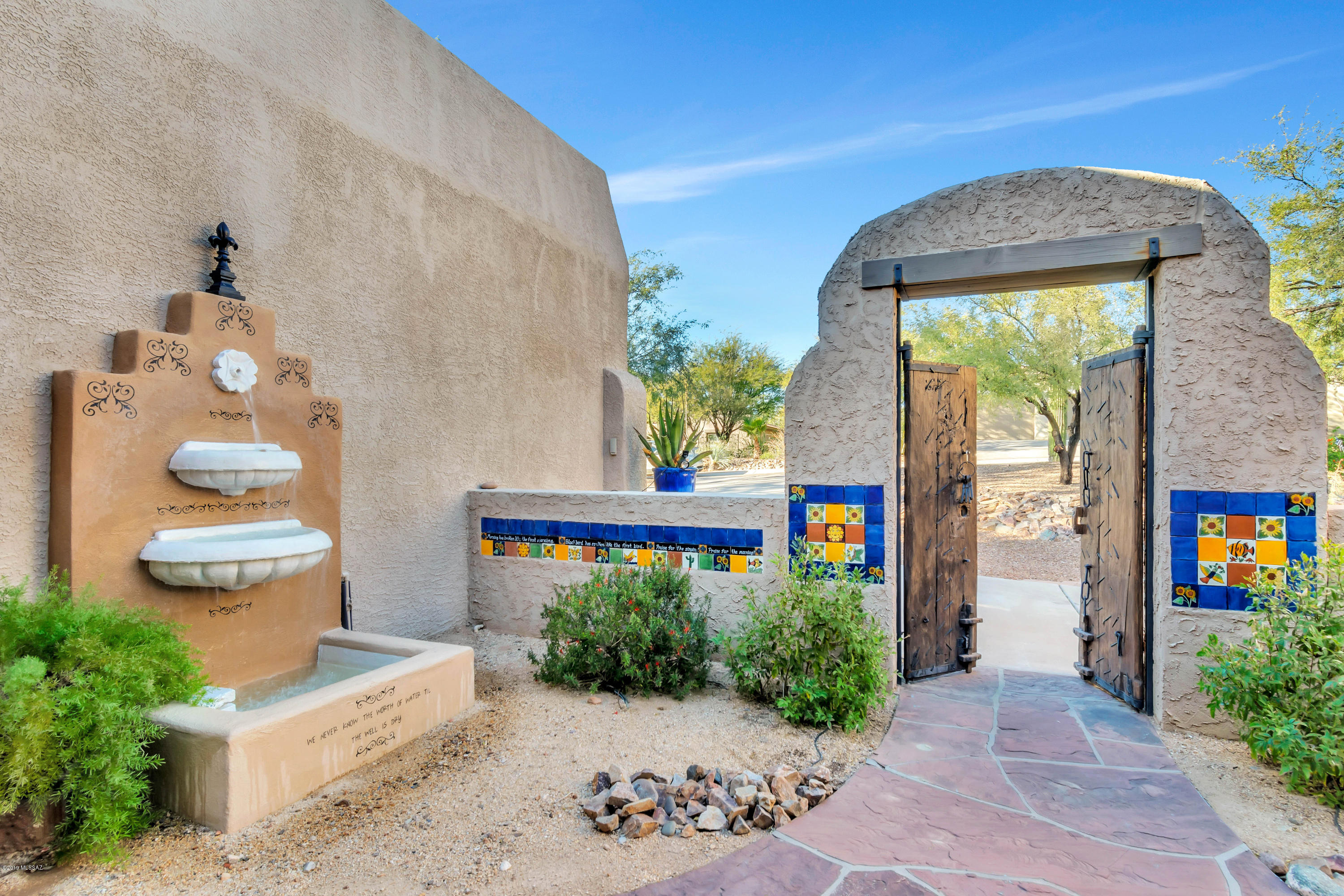 12682 North Spirit Mountain Road Oro Valley, AZ 85755 - Photo 22 of 40 a front view of a house with garden